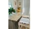 Kitchen breakfast nook with granite countertop and seating for two at 15316 Gulf Blvd # 301, Madeira Beach, FL 33708