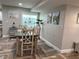 Dining area with rustic table and chairs, coastal decor at 15316 Gulf Blvd # 301, Madeira Beach, FL 33708