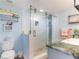 Modern bathroom with a walk-in shower and marble-look vanity at 15316 Gulf Blvd # 301, Madeira Beach, FL 33708