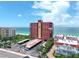 Aerial view of beachfront condo building and parking at 15316 Gulf Blvd # 301, Madeira Beach, FL 33708