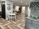 Open kitchen with breakfast nook, modern appliances, and granite counters at 15316 Gulf Blvd # 301, Madeira Beach, FL 33708