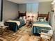 Guest bedroom with twin beds and coastal decor at 15316 Gulf Blvd # 301, Madeira Beach, FL 33708