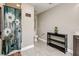 Bathroom with vanity, toilet, and shower with floral curtain at 6628 1St N St, St Petersburg, FL 33702