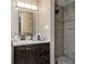Bathroom with vanity, mirror, and tiled shower at 6628 1St N St, St Petersburg, FL 33702