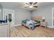 Bedroom with a bed, nightstands, and a view into another room at 6628 1St N St, St Petersburg, FL 33702