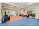 Bonus room with laundry area and colorful floor mats for activities at 6628 1St N St, St Petersburg, FL 33702