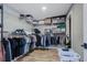 Walk-in closet with built-in shelving and ample storage space for clothes and other belongings at 6628 1St N St, St Petersburg, FL 33702