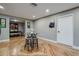 Dining area adjacent to the kitchen with a round table and hardwood floors at 6628 1St N St, St Petersburg, FL 33702