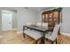 Dining room with a dark wood table, beige chairs, and a china cabinet at 6628 1St N St, St Petersburg, FL 33702