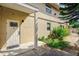Exterior view of the home's entrance with landscaping and a walkway at 6628 1St N St, St Petersburg, FL 33702
