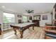 Game room featuring a pool table, bar area, comfortable seating, and decorative accents at 6628 1St N St, St Petersburg, FL 33702