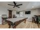 Well-equipped game room with pool table, dartboard, and wall-mounted TV at 6628 1St N St, St Petersburg, FL 33702