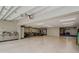 Large, well-lit garage with storage and exercise equipment at 6628 1St N St, St Petersburg, FL 33702