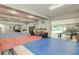 Spacious garage converted into a home gym with exercise mats and equipment at 6628 1St N St, St Petersburg, FL 33702