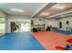 Garage converted to home gym with mats, mirrors, and exercise equipment at 6628 1St N St, St Petersburg, FL 33702