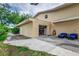 Attached garage with open door and outdoor seating area at 6628 1St N St, St Petersburg, FL 33702