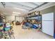 Garage interior with storage, lawn equipment, and a refrigerator at 6628 1St N St, St Petersburg, FL 33702