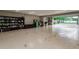 Garage interior with open door, bookcases, and storage boxes at 6628 1St N St, St Petersburg, FL 33702