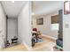 View of a home office from the hallway with wooden floors and a staircase at 6628 1St N St, St Petersburg, FL 33702