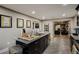 Modern kitchen with island, dark cabinets, and stainless steel appliances at 6628 1St N St, St Petersburg, FL 33702