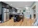 Modern kitchen with stainless steel appliances, island, and ample counter space at 6628 1St N St, St Petersburg, FL 33702