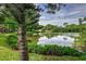 Scenic view of a tranquil lake with a house in the background at 6628 1St N St, St Petersburg, FL 33702
