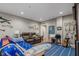 Living area with comfortable seating, entertainment center, and musical instruments at 6628 1St N St, St Petersburg, FL 33702