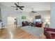 Living area with vaulted ceilings, ceiling fans, area rug, and leather furniture at 6628 1St N St, St Petersburg, FL 33702