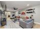 Spacious living room with large TV, comfortable seating, and stylish decor at 6628 1St N St, St Petersburg, FL 33702