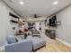 Living room with sectional sofa, entertainment center, and ceiling fan at 6628 1St N St, St Petersburg, FL 33702