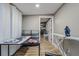 Home office or study area with a desk, storage shelves, and a view of the closet at 6628 1St N St, St Petersburg, FL 33702