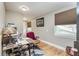Home office with a desk, chair, and window with blinds, perfect for working from home at 6628 1St N St, St Petersburg, FL 33702