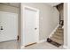 View of the stairway, entryway door, and a door to another room at 6628 1St N St, St Petersburg, FL 33702