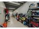 Storage room with kayaks, bikes, and other equipment neatly stored on shelves and wall mounts at 6628 1St N St, St Petersburg, FL 33702