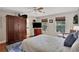 Bright bedroom featuring a large closet and hardwood floors at 8608 Poinsettia Dr, Temple Terrace, FL 33637
