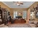 Spacious home office with ample built-in shelving and hardwood floors at 8608 Poinsettia Dr, Temple Terrace, FL 33637