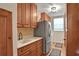 Bright laundry room with washer, dryer, and extra storage at 8608 Poinsettia Dr, Temple Terrace, FL 33637