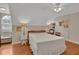 Serene bedroom with hardwood floors and a vaulted ceiling at 8608 Poinsettia Dr, Temple Terrace, FL 33637