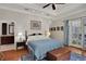 Bright Primary bedroom with direct access to backyard patio at 8608 Poinsettia Dr, Temple Terrace, FL 33637