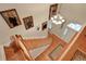 Elegant wooden staircase with hardwood floors and framed portraits on the wall at 8608 Poinsettia Dr, Temple Terrace, FL 33637