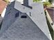 Overhead view of a dark gray shingle roof with vents and dormers at 11928 Frost Aster Dr, Riverview, FL 33579