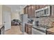 Well-equipped kitchen with stainless steel appliances and ample counter space at 11928 Frost Aster Dr, Riverview, FL 33579