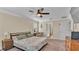 Comfortable bedroom with king bed and access to the bathroom at 11928 Frost Aster Dr, Riverview, FL 33579