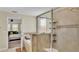 Bathroom with shower, tub, and view of bedroom at 11928 Frost Aster Dr, Riverview, FL 33579