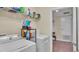 Laundry room with washer, dryer, and storage shelving at 11928 Frost Aster Dr, Riverview, FL 33579