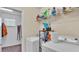 Well-equipped laundry room with washer, dryer, and ample storage shelving at 11928 Frost Aster Dr, Riverview, FL 33579