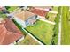 Aerial view of a large backyard with a gray house and white fence at 11928 Frost Aster Dr, Riverview, FL 33579