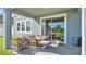 Relaxing covered patio with comfortable seating and a view of the backyard at 11928 Frost Aster Dr, Riverview, FL 33579