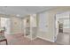 Upstairs hallway with carpet, access to bedrooms, and a staircase at 11928 Frost Aster Dr, Riverview, FL 33579