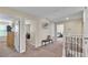 Upstairs hallway with carpet flooring and multiple bedroom access points at 11928 Frost Aster Dr, Riverview, FL 33579